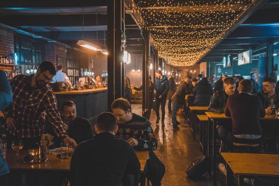 Inside Cutlery Works, filled with customers dining.