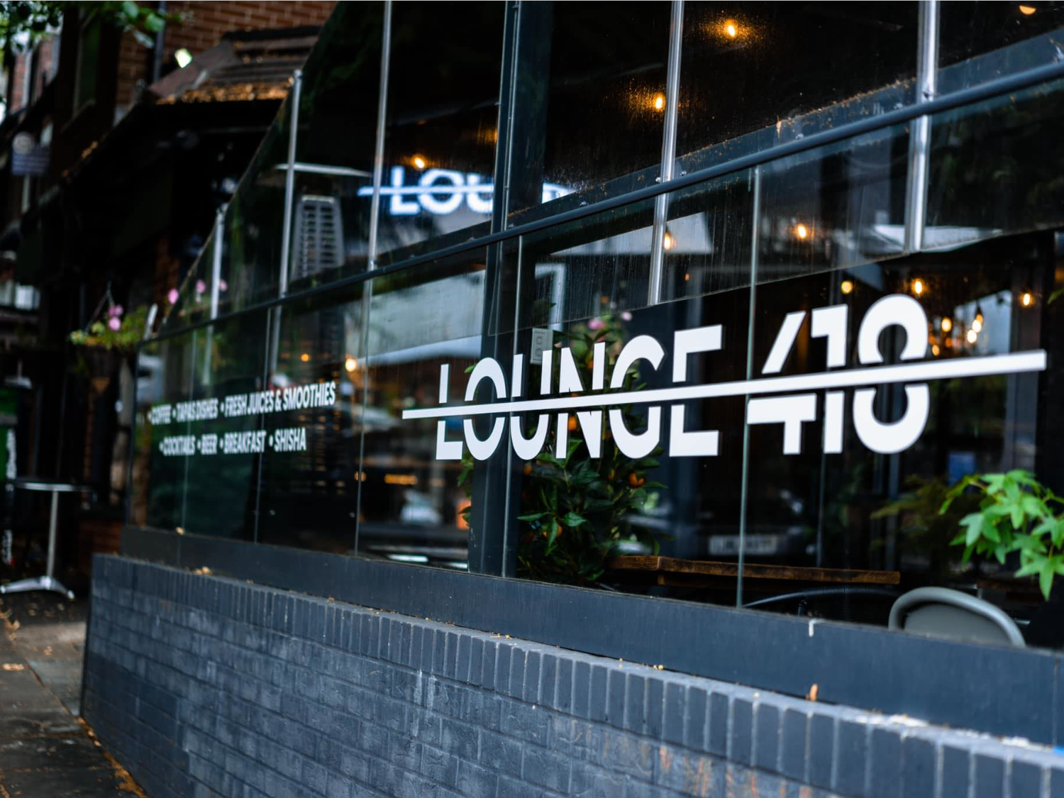 Lounge 418 window with their logo.