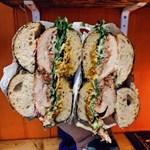 A packed bagel, cut in half so you can see all the fillings, from Best Boy Bagels.