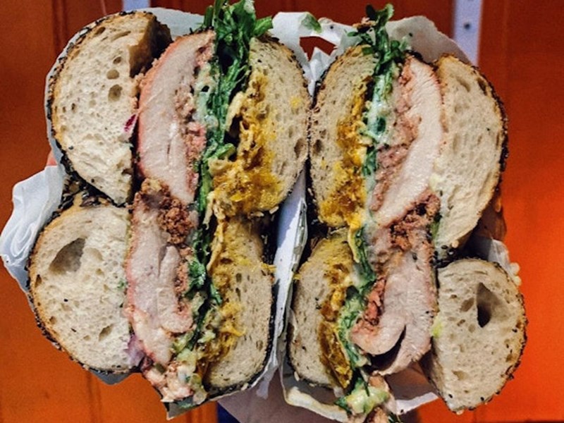 A packed bagel, cut in half so you can see all the fillings, from Best Boy Bagels.