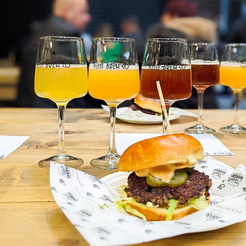 A burger and a row of beers.