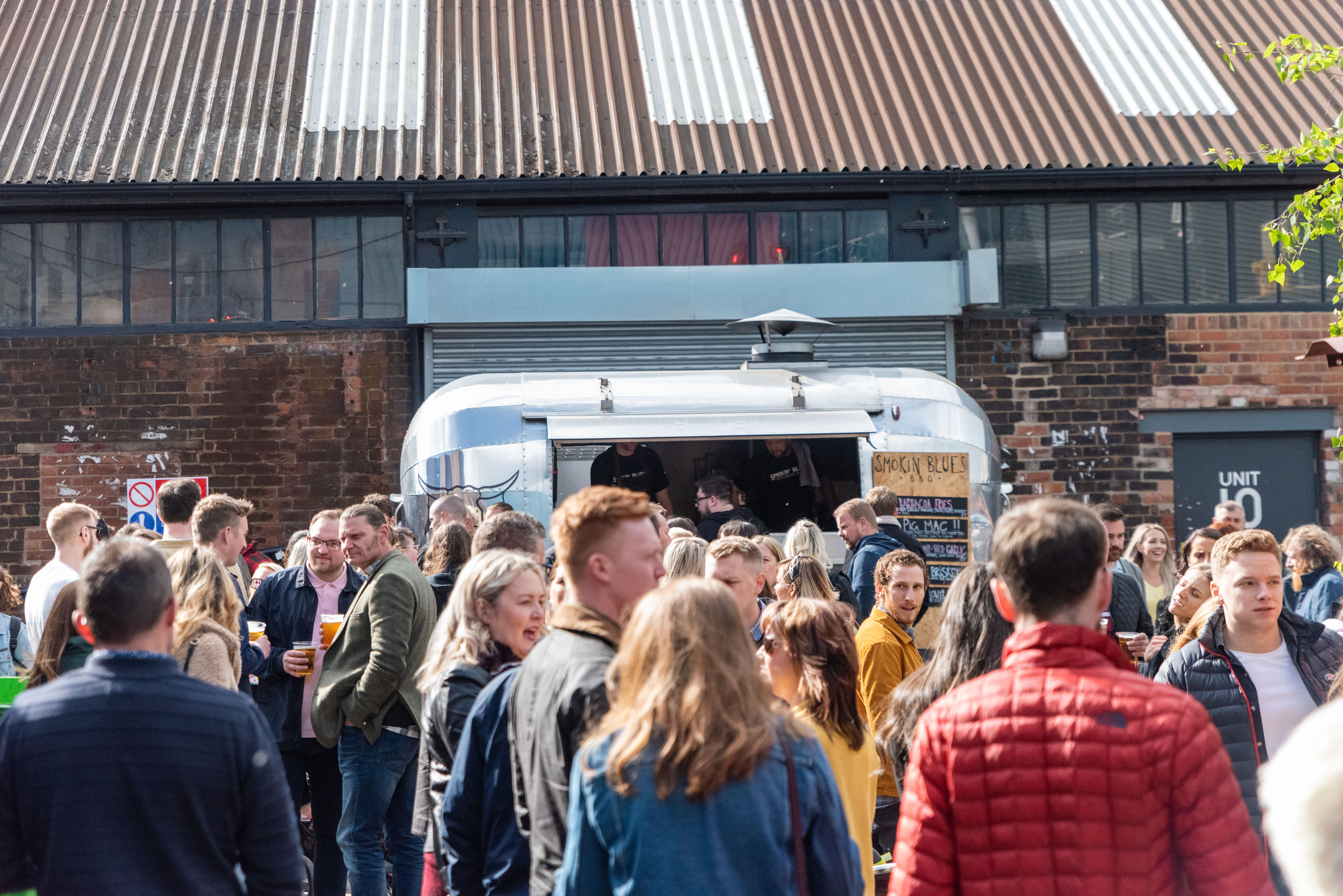 A crowd of people outside at Peddler.