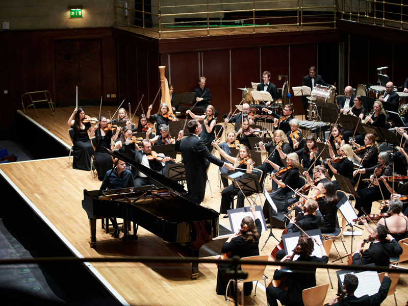 The Brigantes Orchestra performing on a stage.