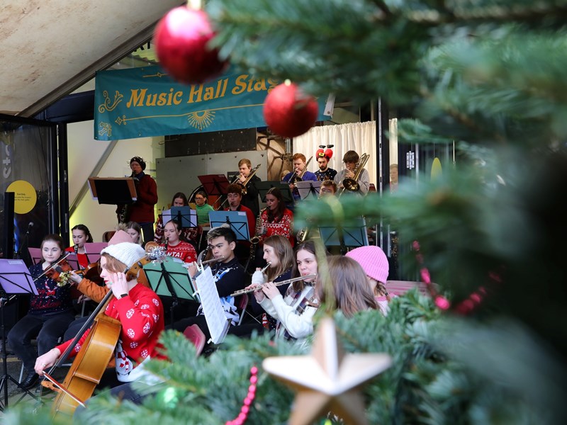 Brass band playing at  Kelham Island Museum with festive decorations