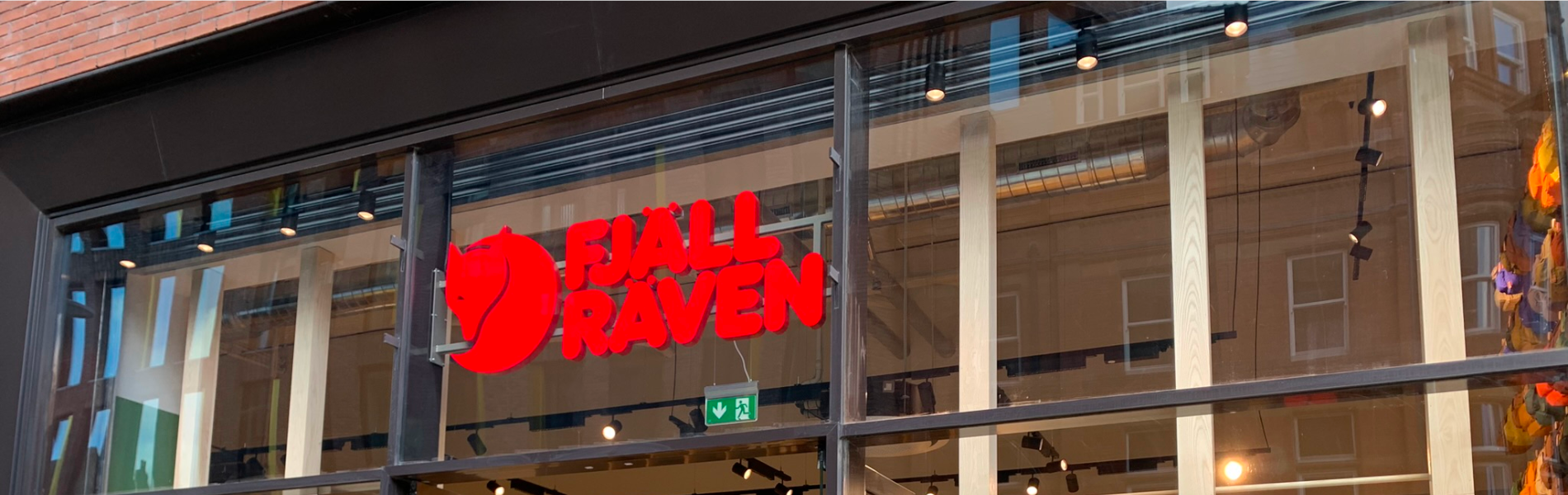The Fjallraven logo on the Sheffield store window.