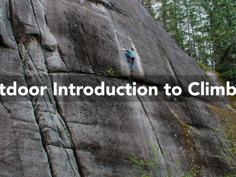 A person climbing a grit stone rock face. Over the image are the words 'Outdoor Introduction To Climbing'.