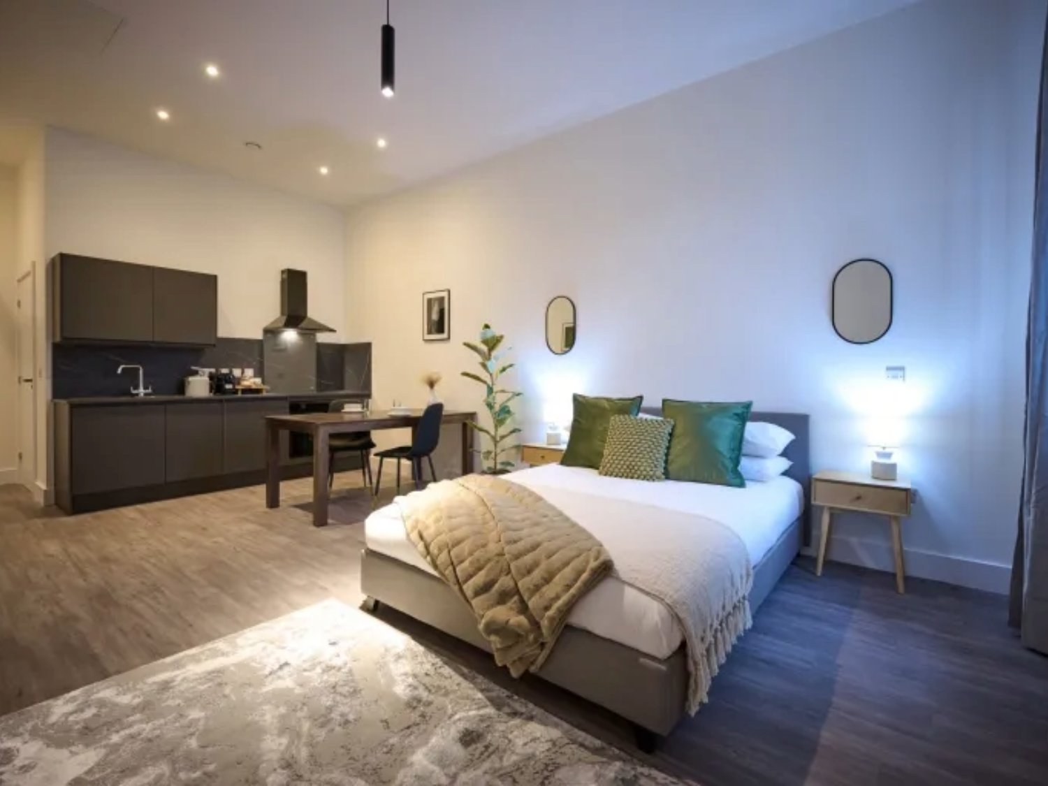 A room with a double bed at JÖRO Oughtibridge Mill.