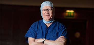 David Stanley wearing surgical scrubs.