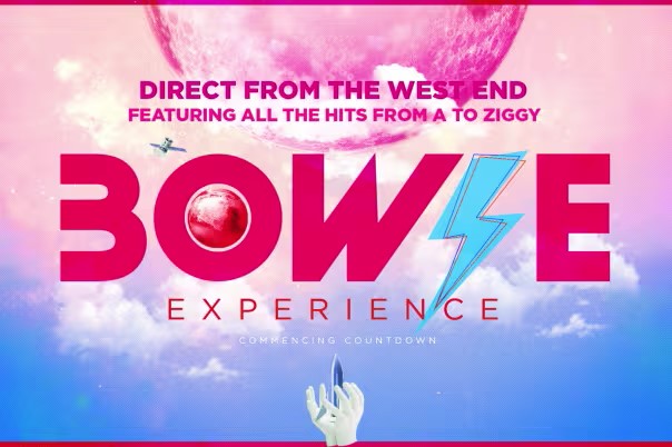 Promotional poster for “Bowie Experience.” The design features bold pink text with a blue lightning bolt in the word “Bowie.” Above, the tagline reads: “Direct from the West End – Featuring all the hits from A to Ziggy.” The background shows a surreal pink planet in a purple sky with clouds, and a hand pointing upward at the bottom.
