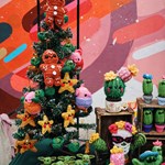 A stall selling crocheted Christmas decorations and cacti.