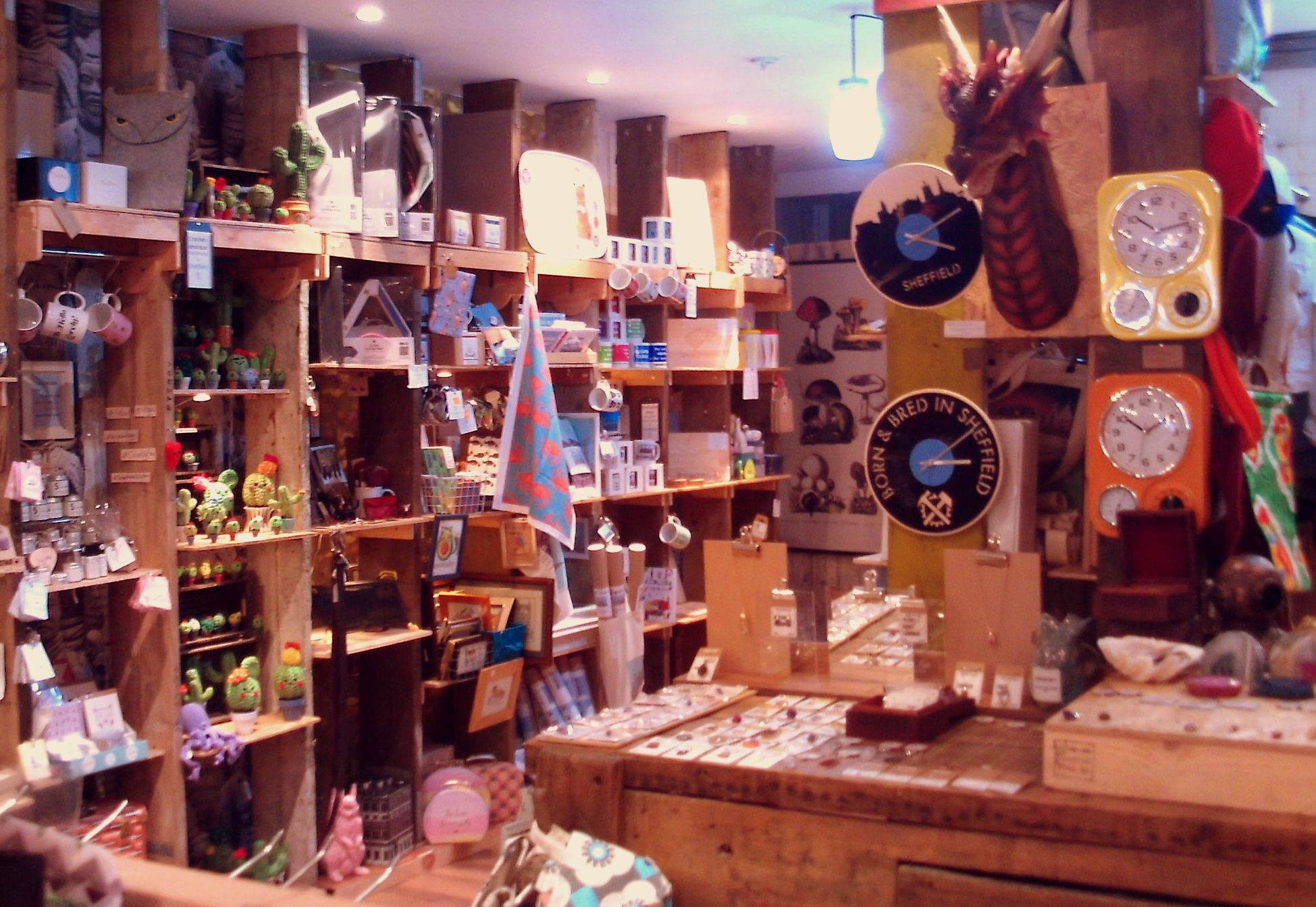 Inside Bird's Yard, the walls are covered in wooden shelves filled with items for sale. 