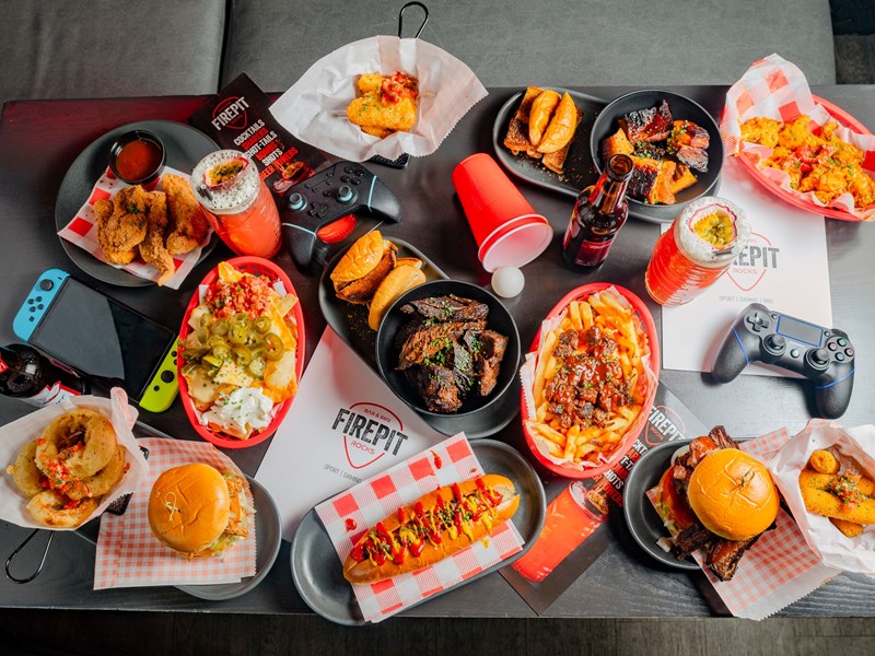 A table full of American style food at FirePit Rocks Bar and BBQ.