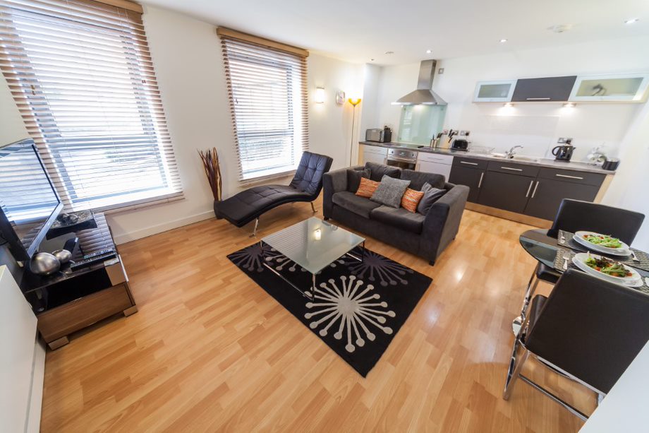 Interior of a living area with seating, a coffee table, and décor, creating a comfortable and inviting space.