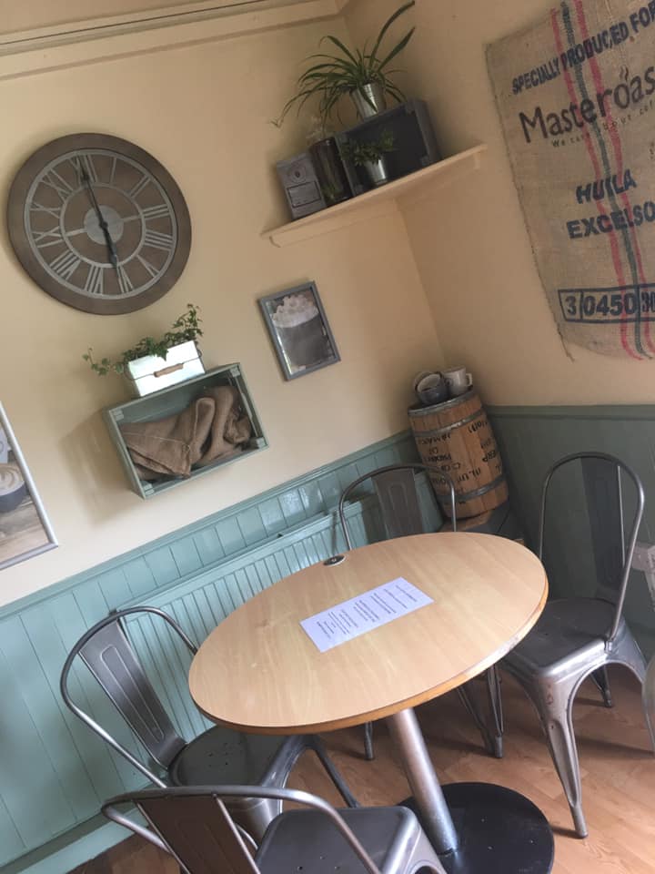 A cosy table in the corner of Millhouses Park Cafe.