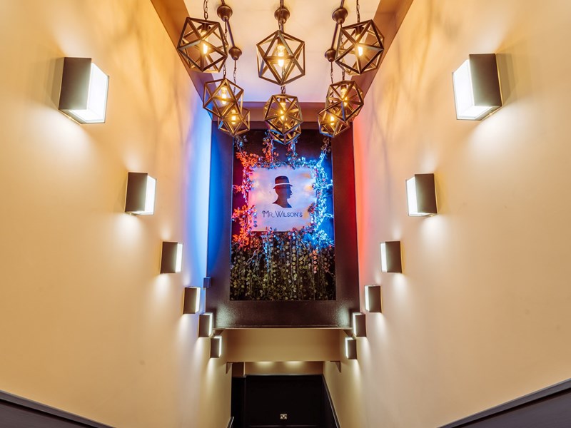 A corridor decorated in 1920s decor.