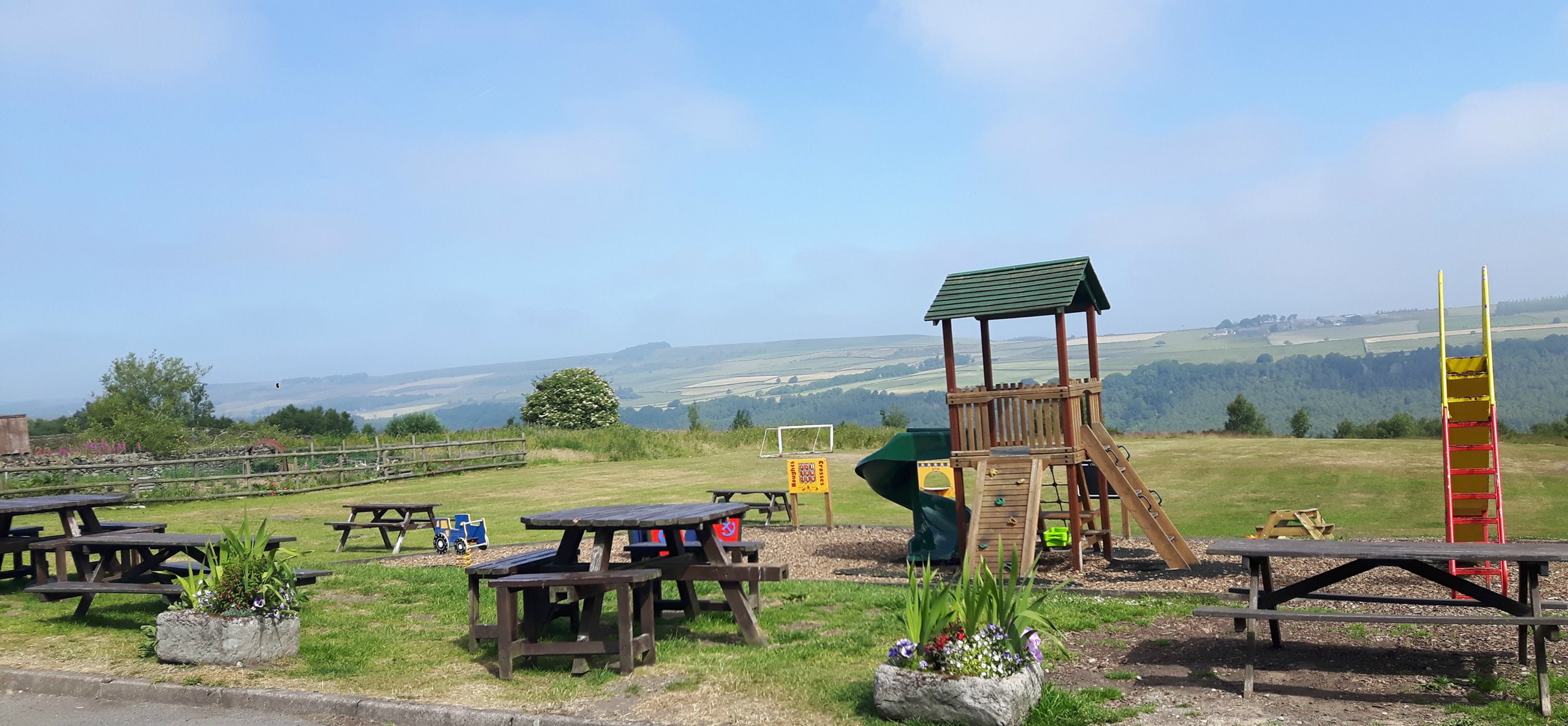 Beer garden and children's play area at the Three Merry Lads.