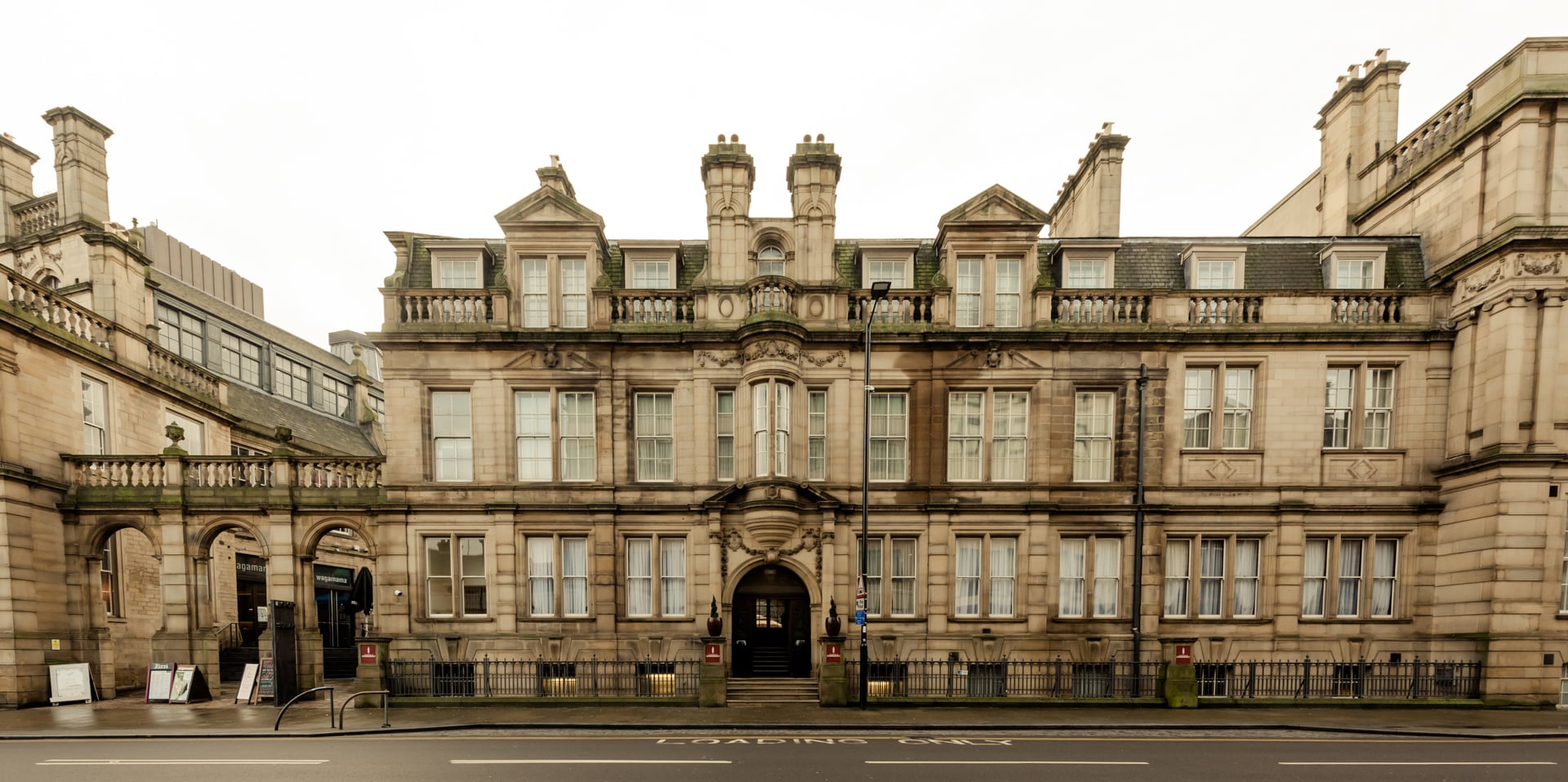 Exterior view of Leopold Hotel showing the building façade and entrance