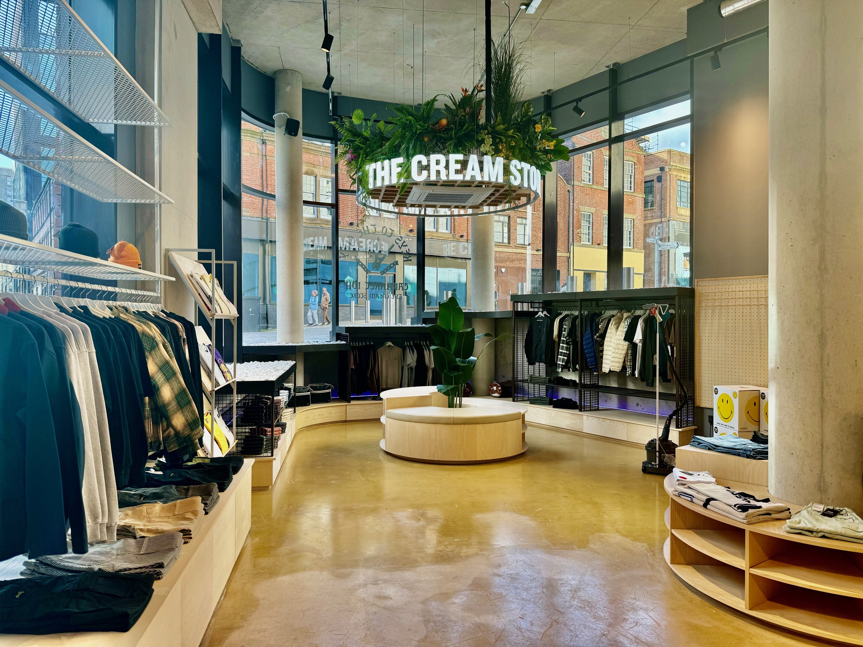 Inside The Cream Store, rails of clothes.