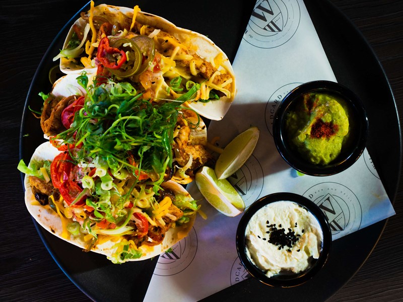 A plate full of tacos at The Wildcard Bar & Grill.