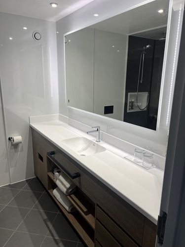 Bathroom with a sink and a mirror mounted above it.