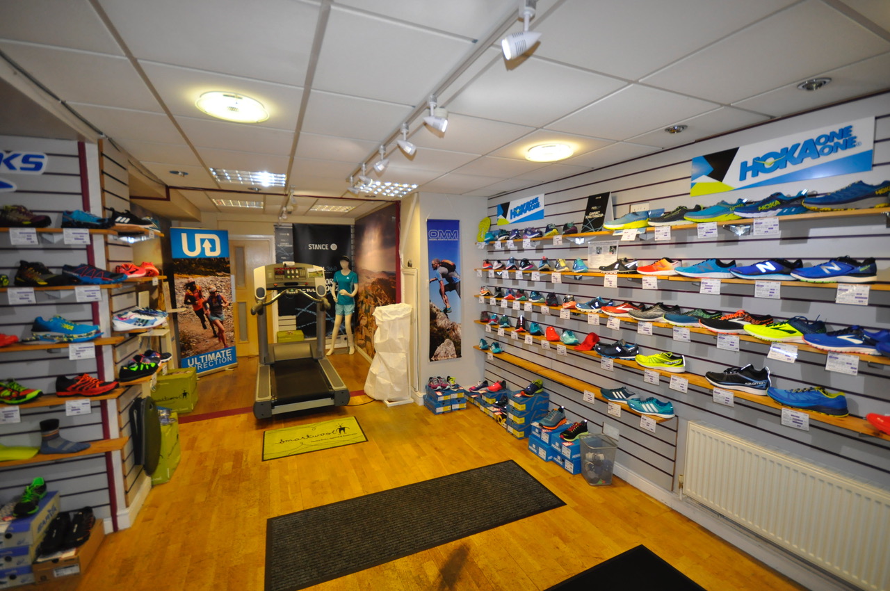 Wall displays full of running shoes at myRaceKit North.