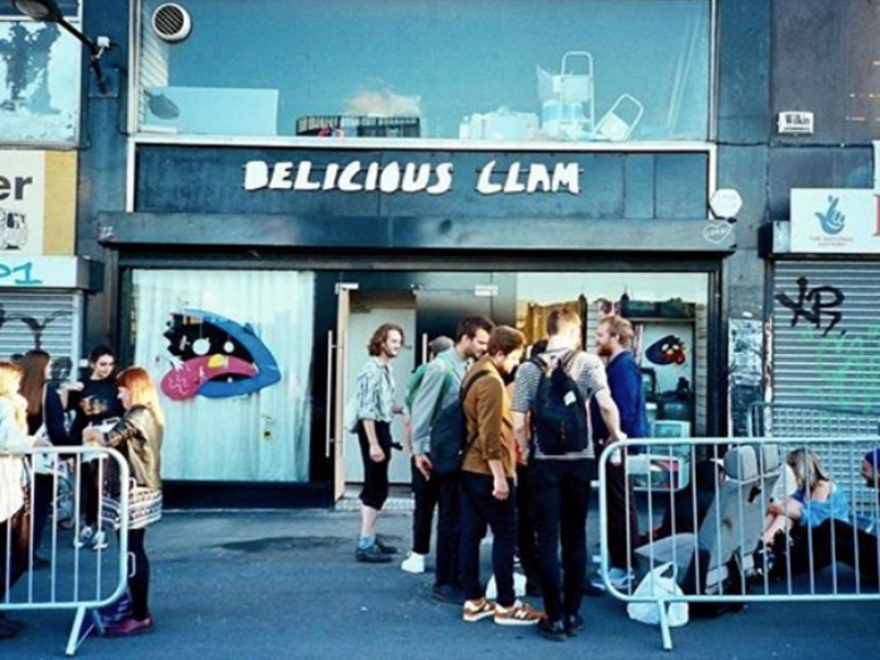 People waiting outside Delicious Clam before a gig.