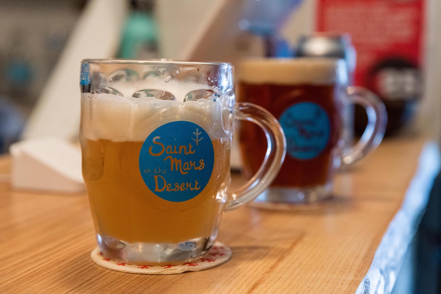 Three pints of beer on a bar top at The Brewery of St Mars of the Desert..
