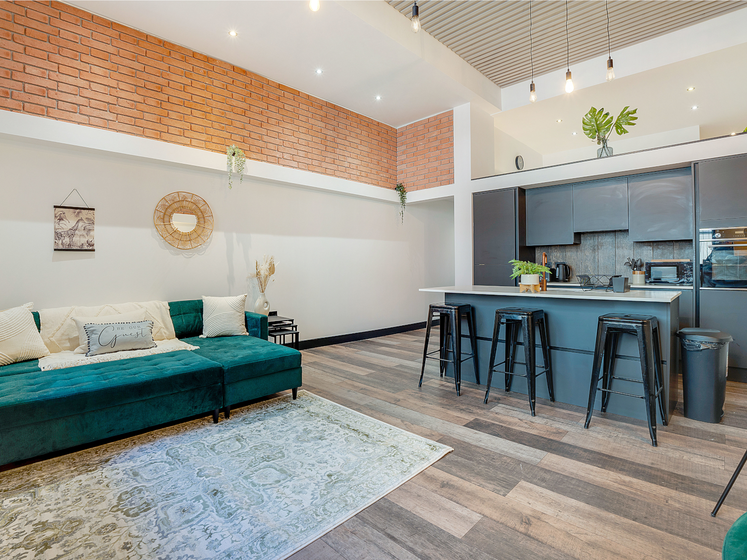 Modern living room with a kitchenette in the same open-plan space.