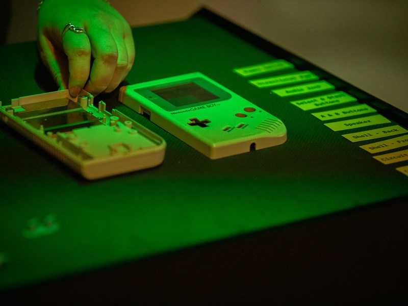 An original GameBoy that has been opened up, on display at The National Videogame Museum