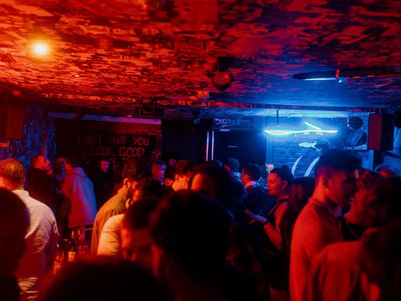 crowd of people in FirePit Rocks Bar and BBQ.