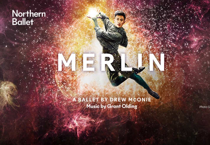 A man is jumping in the air, holding a glowing ball of light, against a backdrop of an explosion of stars.
