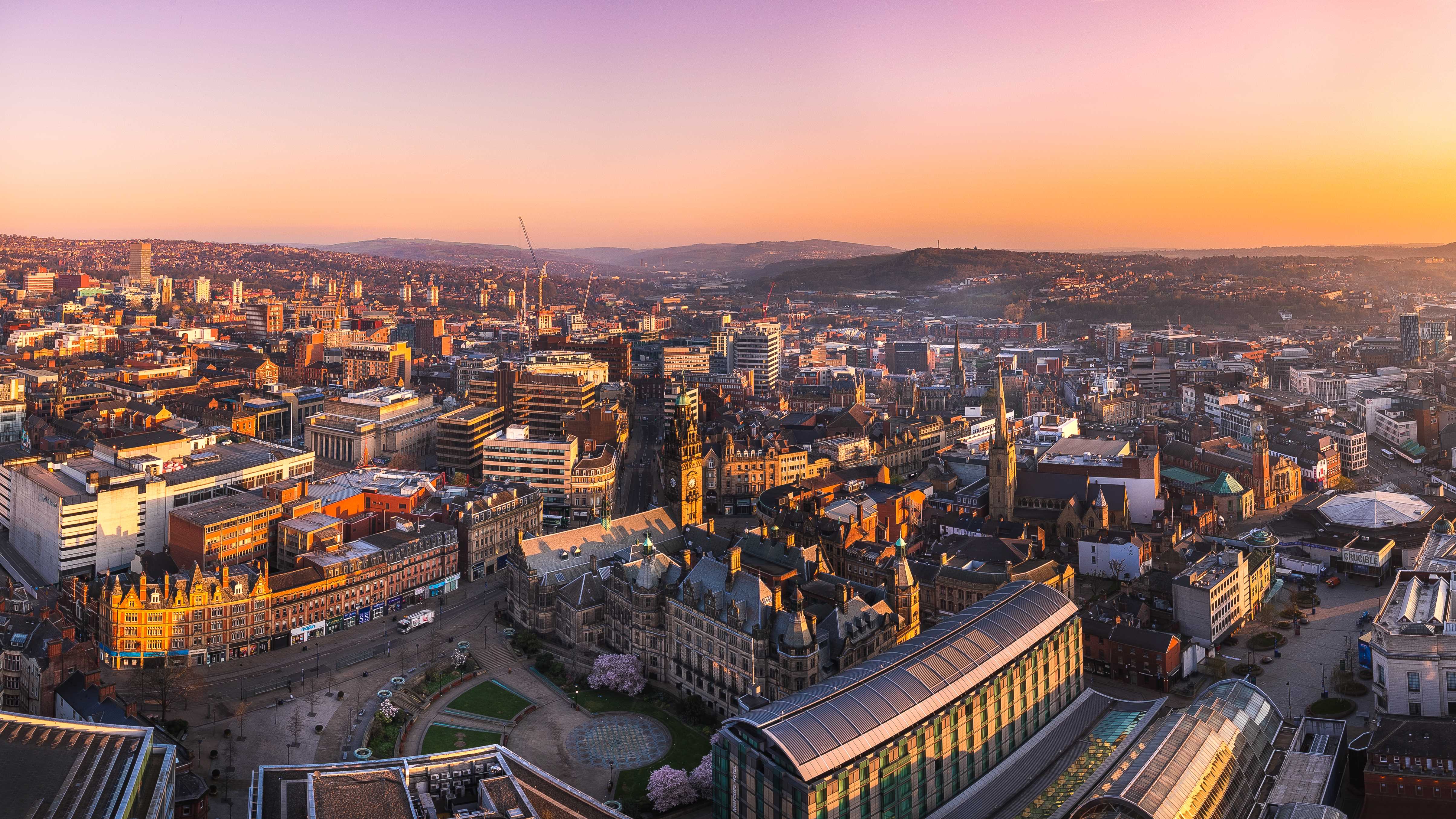 An aerial view of the Sheffield skyline at dawn.