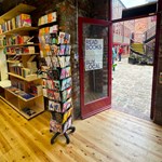 The door to La Biblioteka book shop opening out into Leah'd Yard