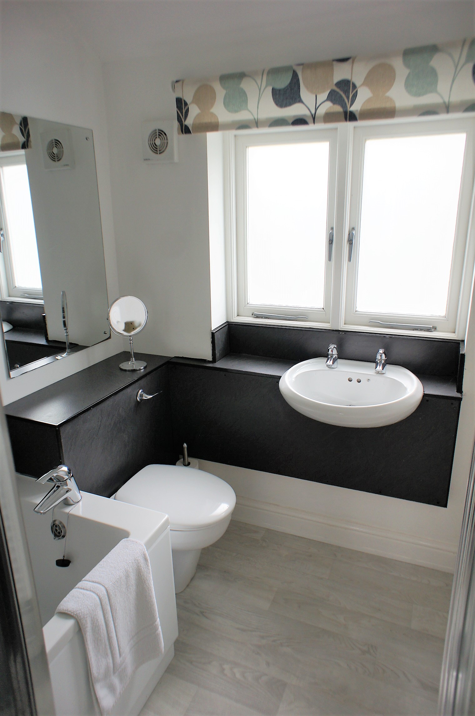 Bathroom with a sink, toilet, and shower or bathtub