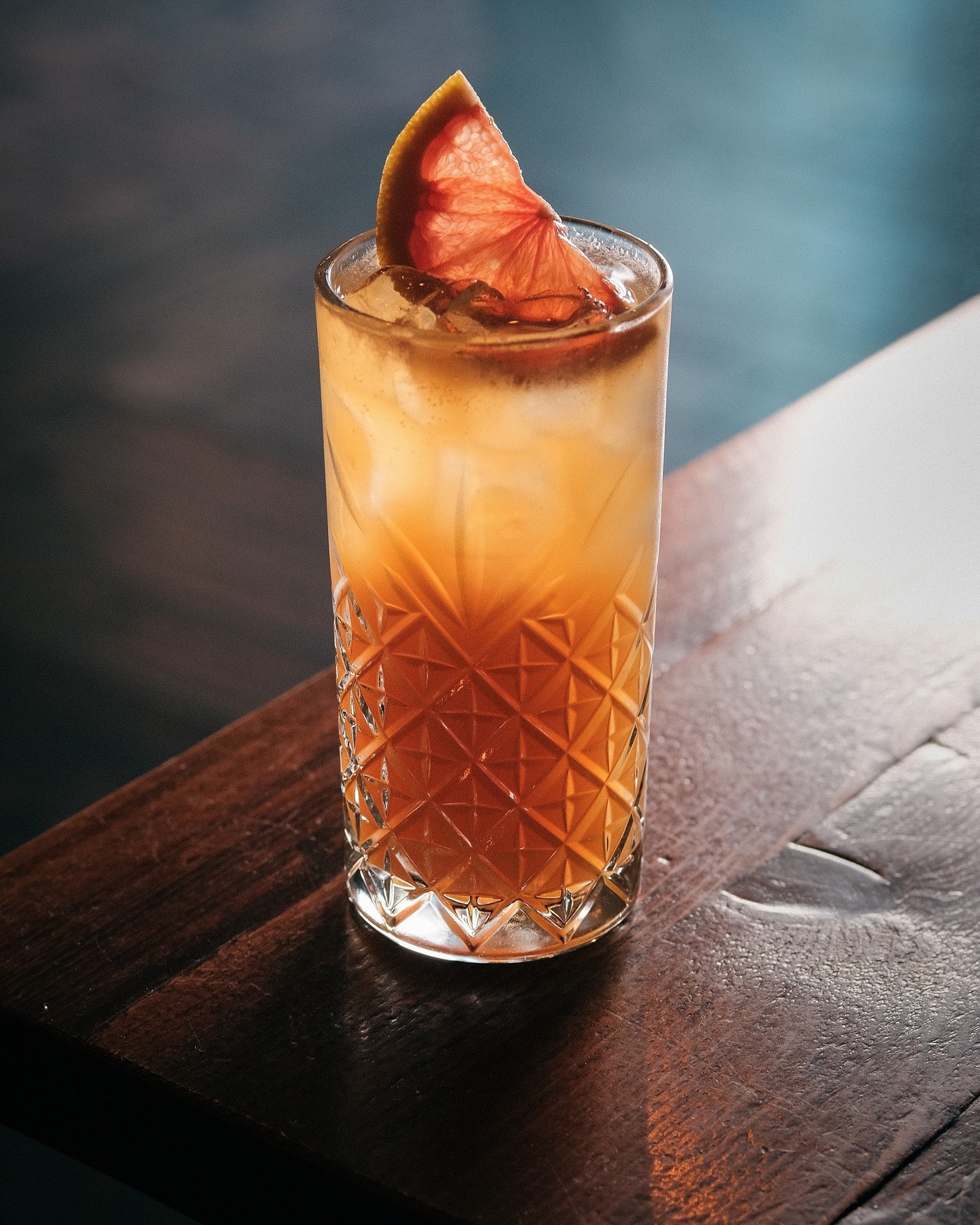 A cocktail in a tall glass.