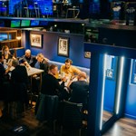 People eating at tables at The Wildcard Bar & Grill.