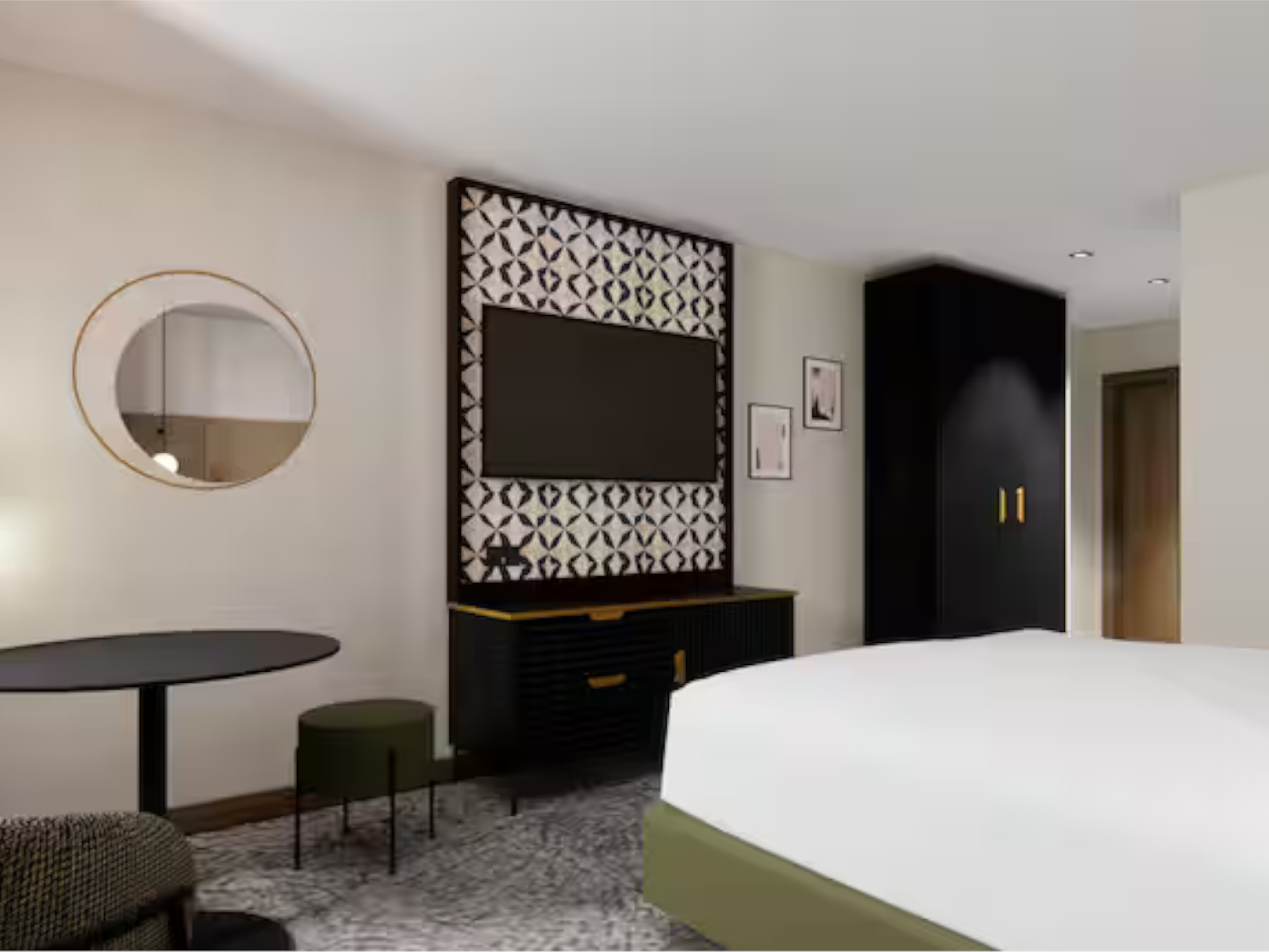 Modern bedroom with TV on wall at the Doubletree by Hilton Sheffield City