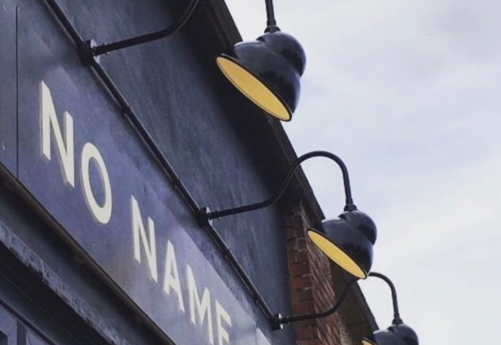 The sign above an entrance read 'No Name'.