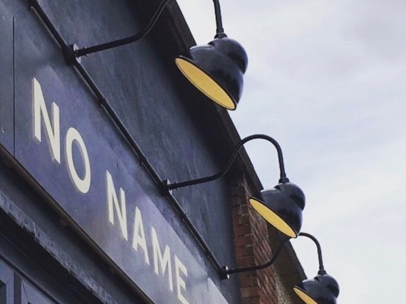 The sign above an entrance read 'No Name'.
