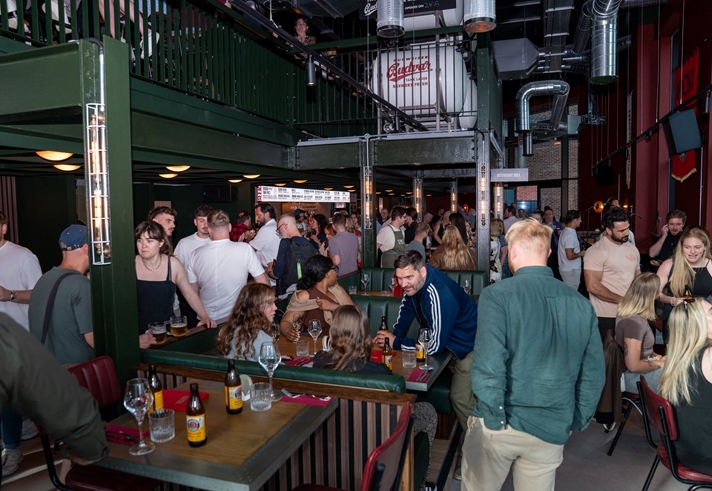 Lots of people socializing at the opening of Kapital Sheffield beer hall