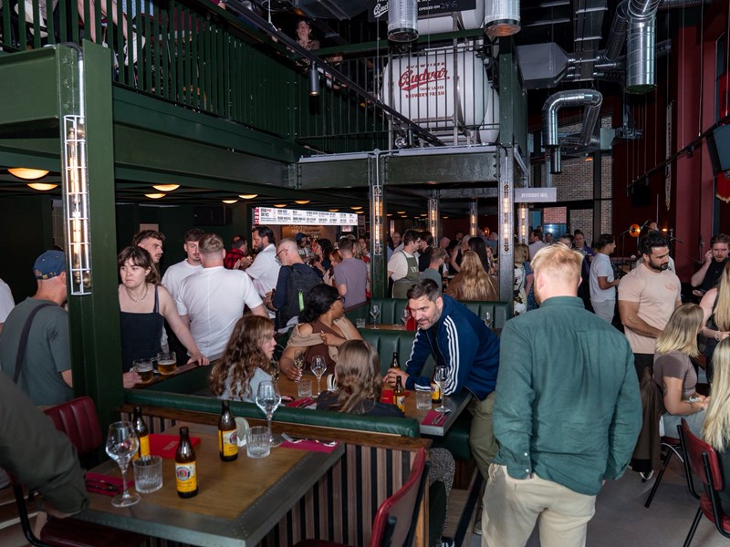 Lots of people socializing at the opening of Kapital Sheffield beer hall