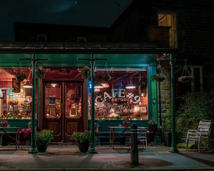 The exterior of Cafe #9 at night.