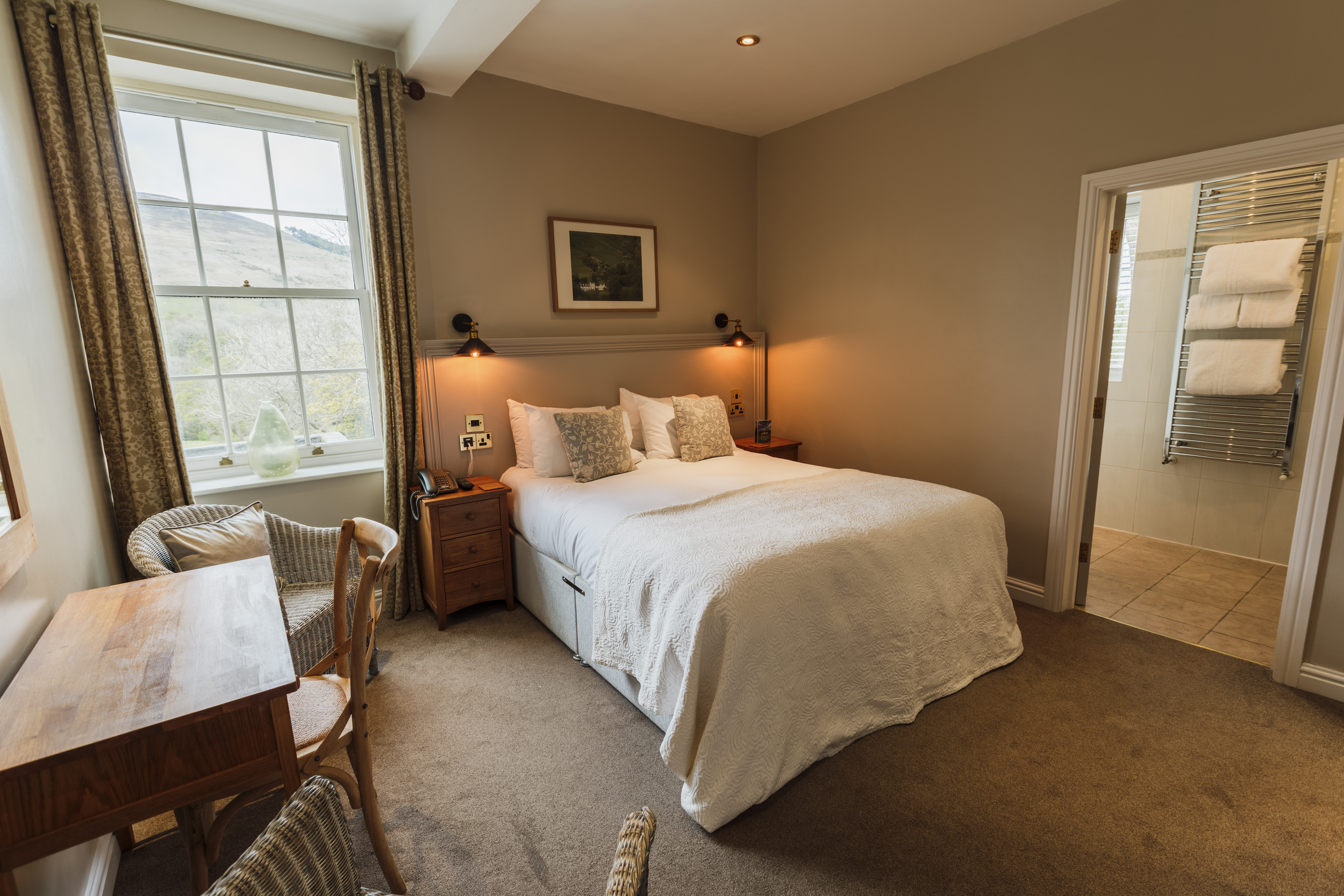 Double bedroom at Losehill Hall Hotel with stylish furnishings and a welcoming atmosphere.