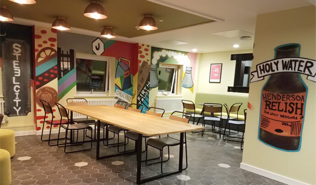 Jonas Court – communal area with seating and open space for residents.