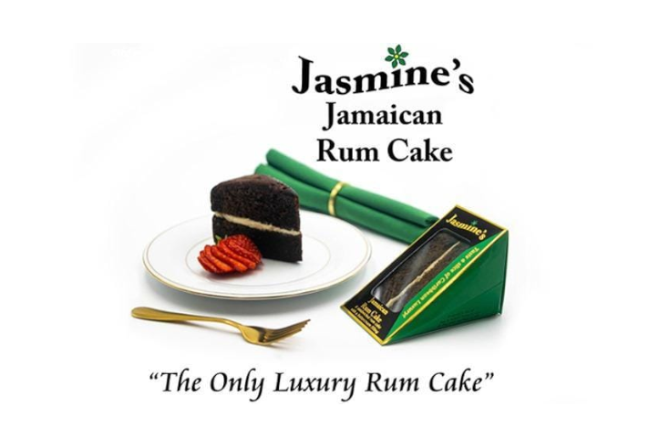Jasmine's Jamaican Rum Cake on a plate next to the packaging.