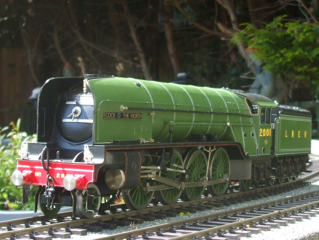 A green locomotive at the Abbeydale Miniature Railway.