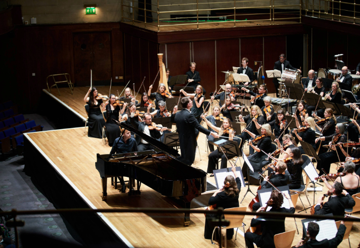 The Brigantes Orchestra performing on a stage.