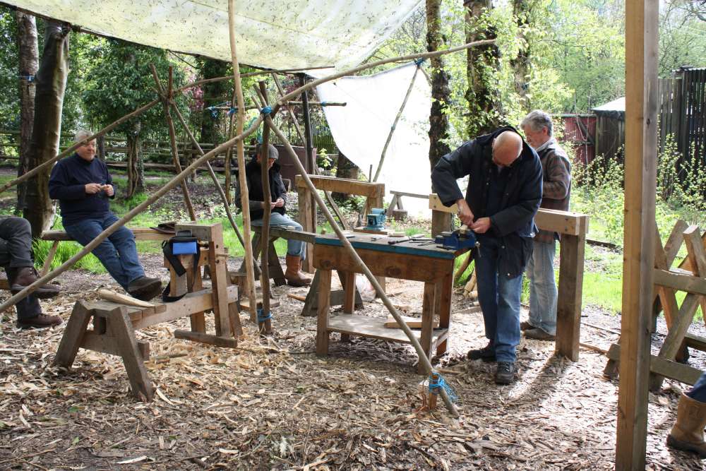 People taking part in a wood craft course at the J.G. Graves Woodland Discovery Centre.