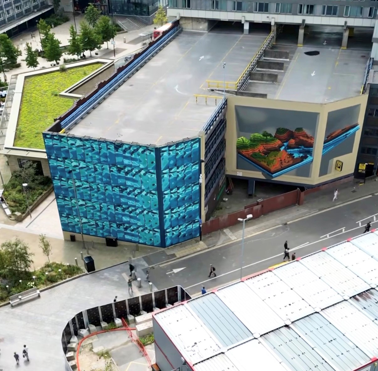 Aerial shot looking down on the building of the NCP car park on Wellington Street in Sheffield where the complete Rivers and Hills mural now adorns it's walls