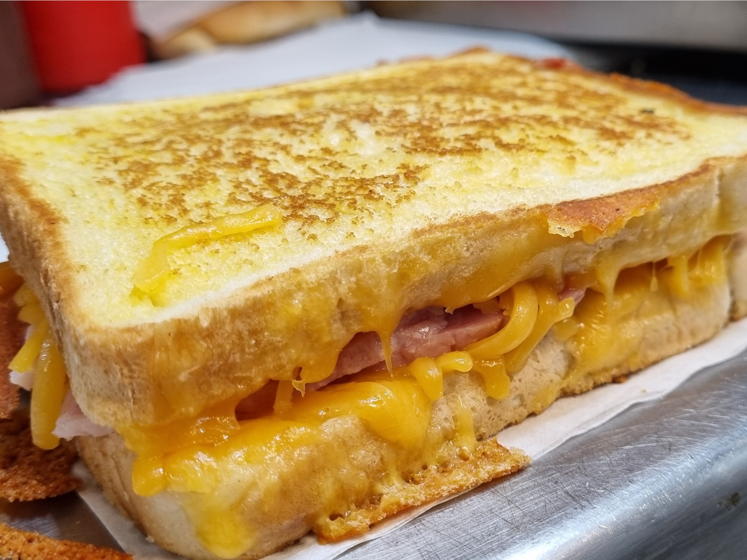 A grilled ham & cheese sandwich.